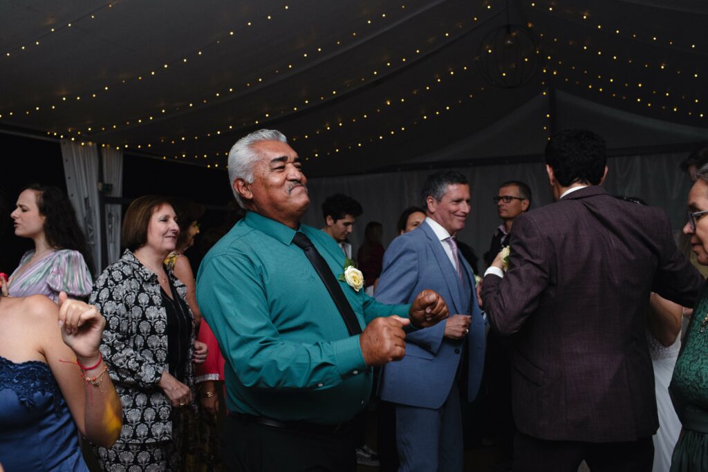 The family dancing at the wedding reception